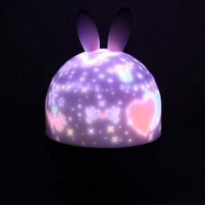 Lampa de veghe pentru copii Rabbit, dimensiune 12 x 16.5 cm, rotativa, cu telecomanda, 6 melodii tematice, lumina led si 6 seturi de folii interschimbabile imagine