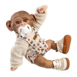 Imagine Papusa reborn maimuta bebelus Guca, 32 cm, corp din vinil, design expresiv si pietenos, complet articulat, cu incaltari sport, pantaloni scurti cu bretele si pulover bej, suzeta cu lant incluse, 3 ani+